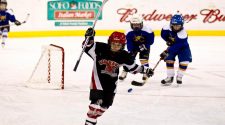 Peewee hockey team playing in the ice skating rink